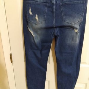 Distressed pull on stretch jeans